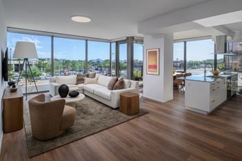 Floor-to-ceiling windows with high-performance glazing and acoustical glass for sound reduction